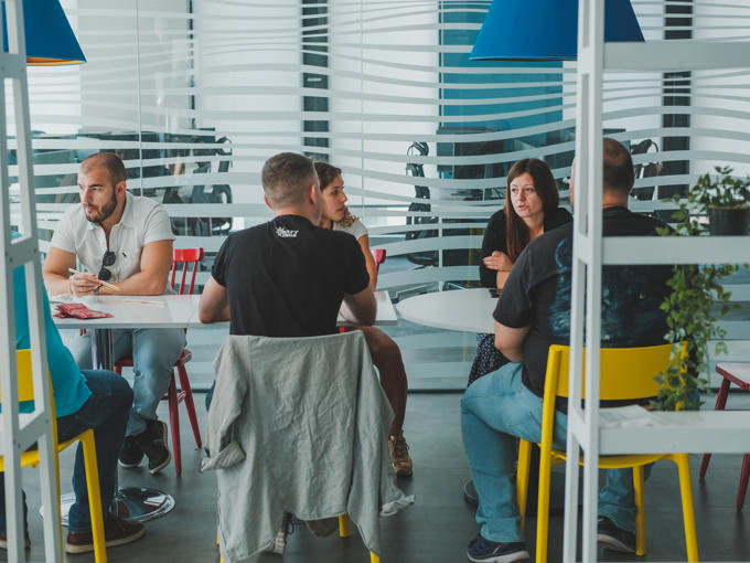 a group of people sitting at tables