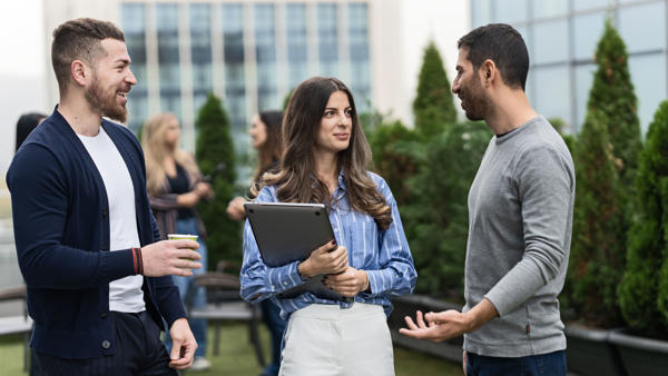 a group of people talking outside