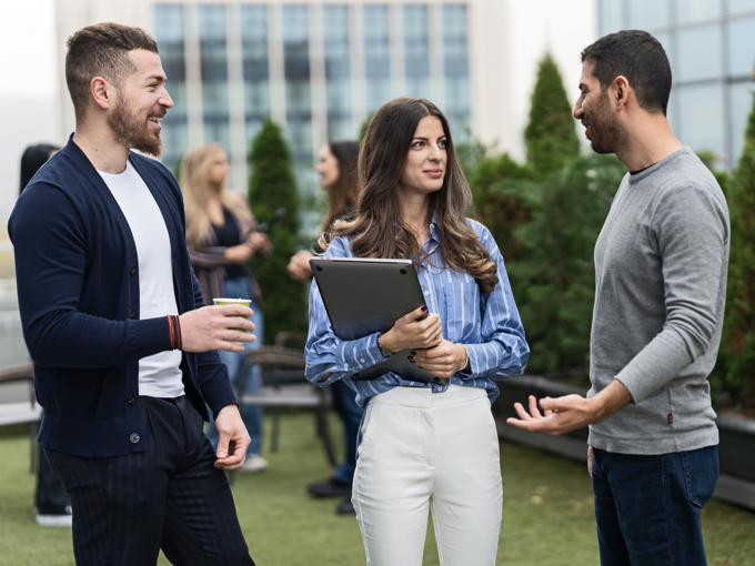a group of people talking outside