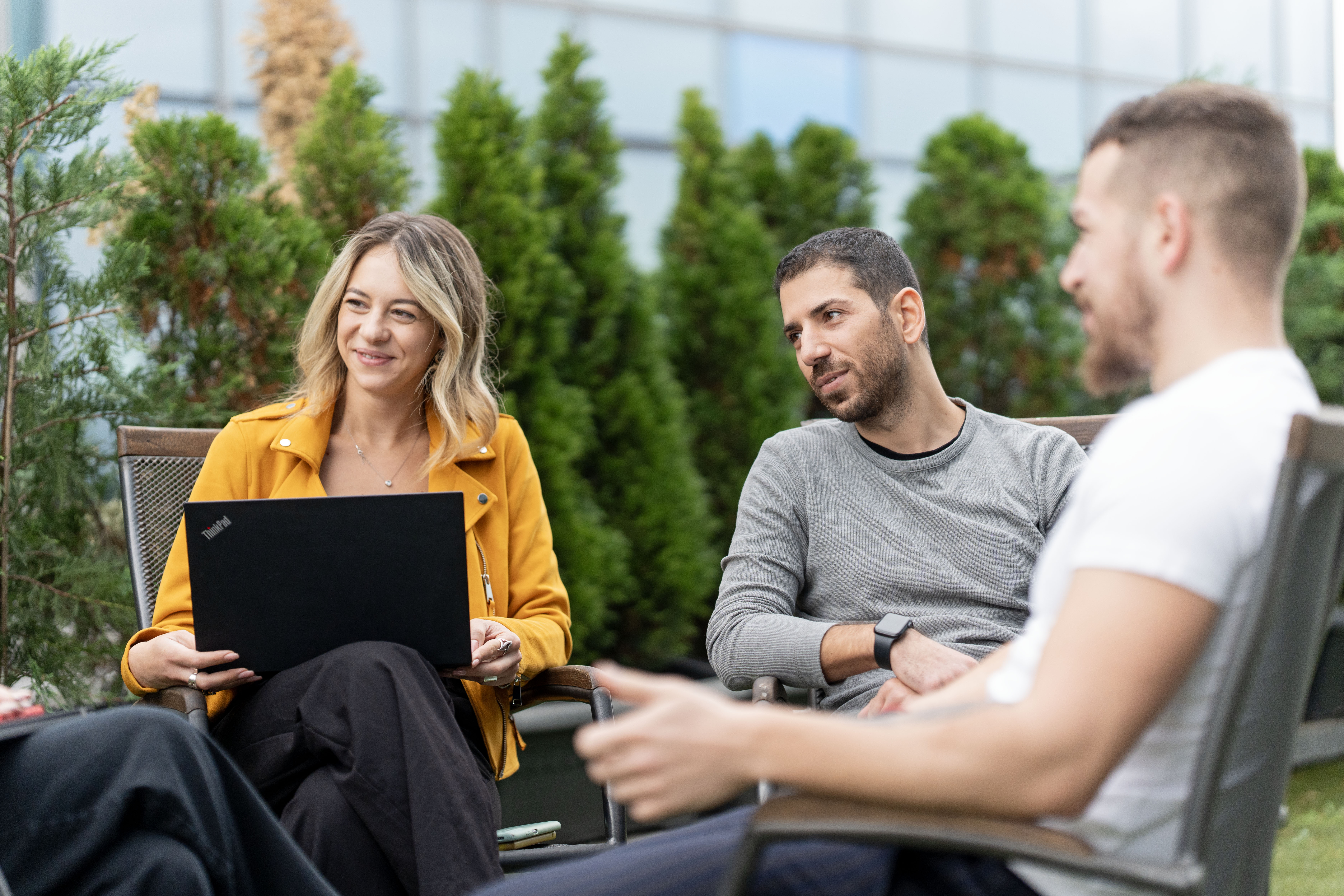 a group of people sitting outside