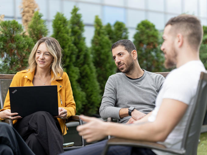 a group of people sitting outside