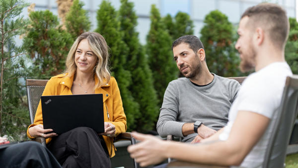 a group of people sitting outside