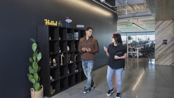 a man and woman standing in a room