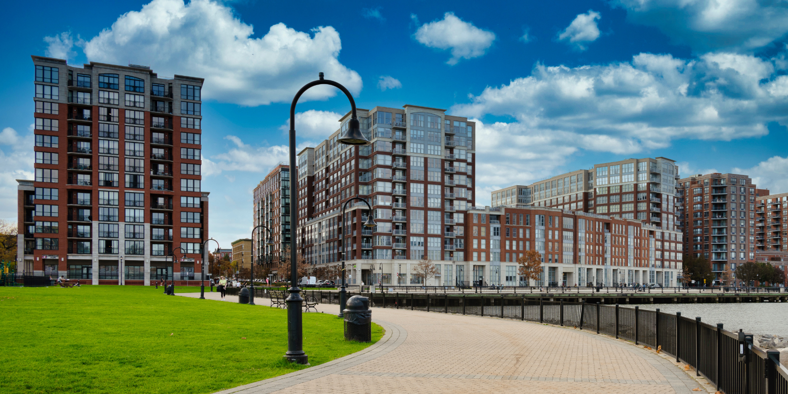 a walkway with a walkway and buildings in the background