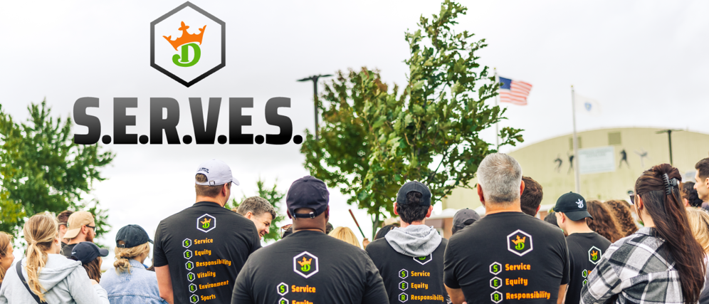 a group of people wearing black shirts with text on them