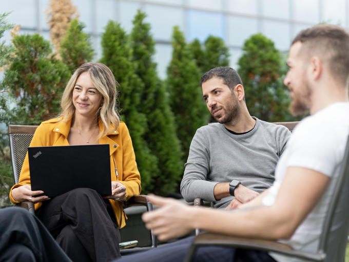 a group of people sitting outside