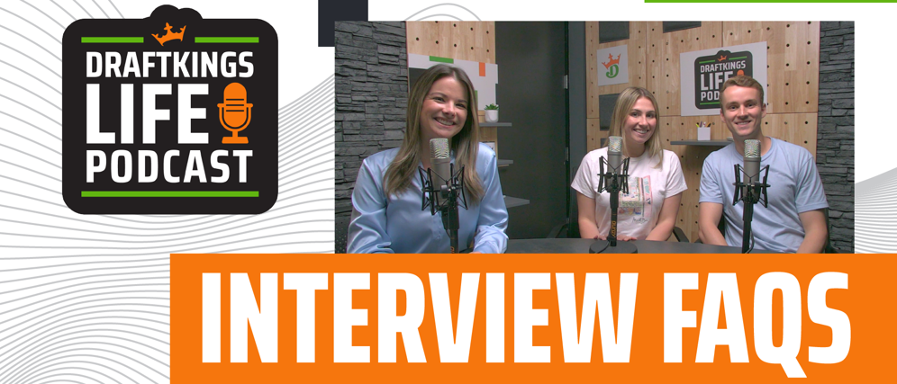 a group of women sitting at a table with microphones
