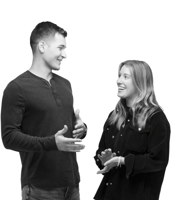 a man and woman standing and talking