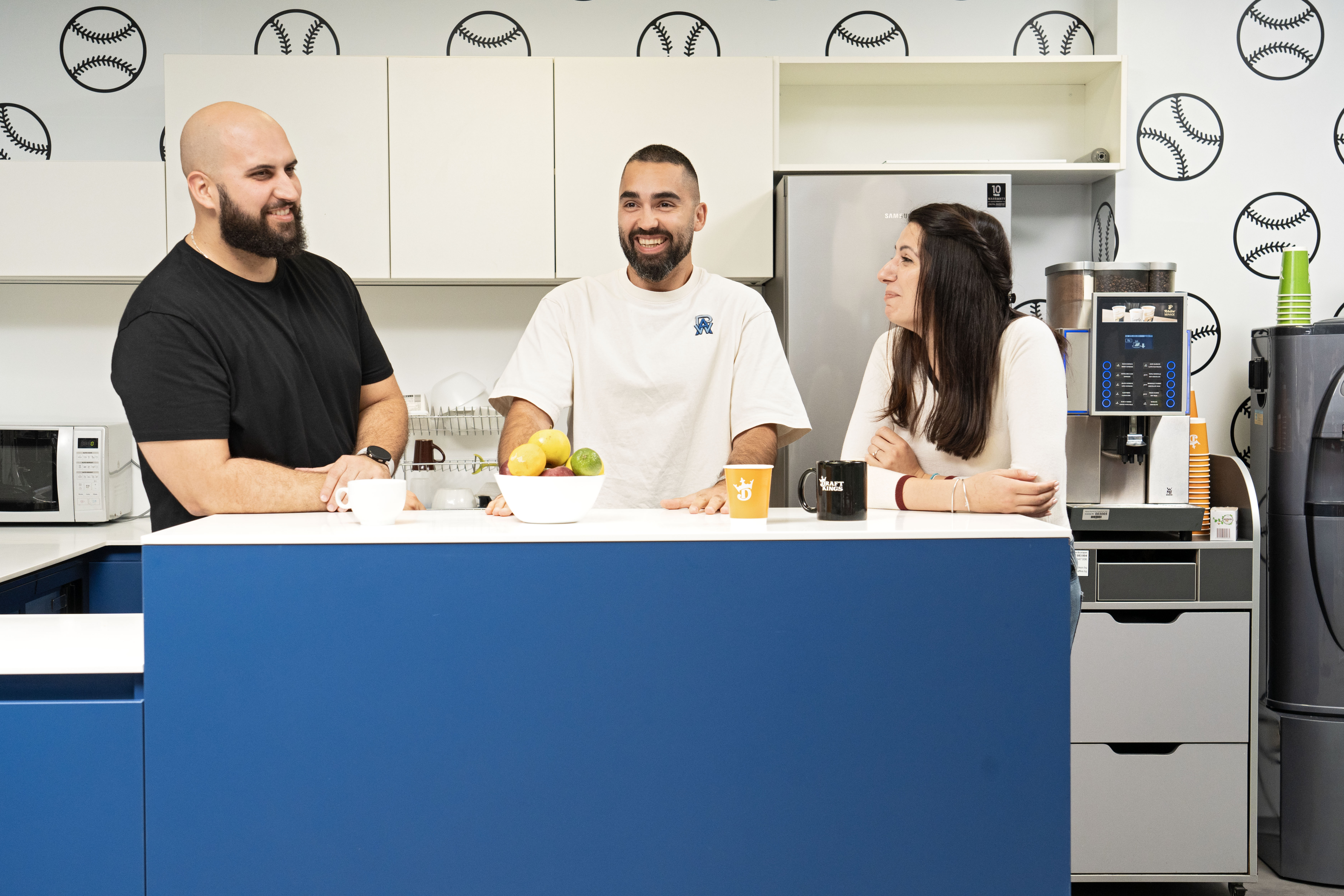 a group of people sitting at a counter