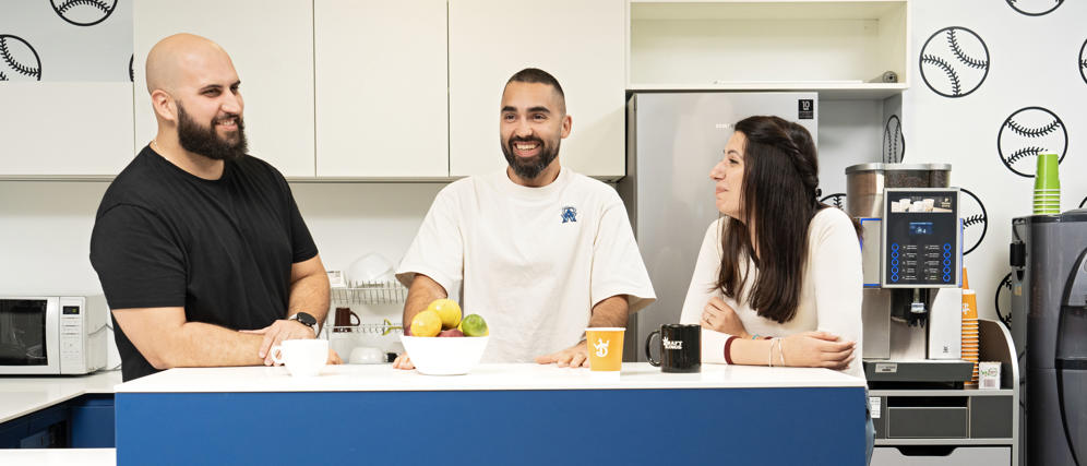 a group of people sitting at a counter