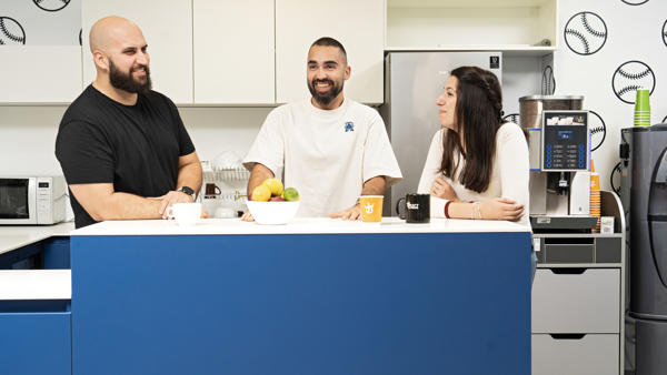 a group of people sitting at a counter