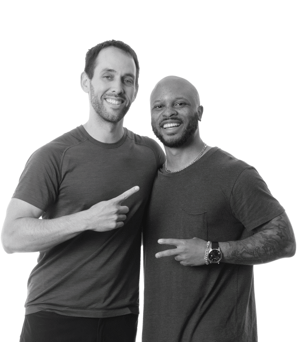 two men standing together smiling