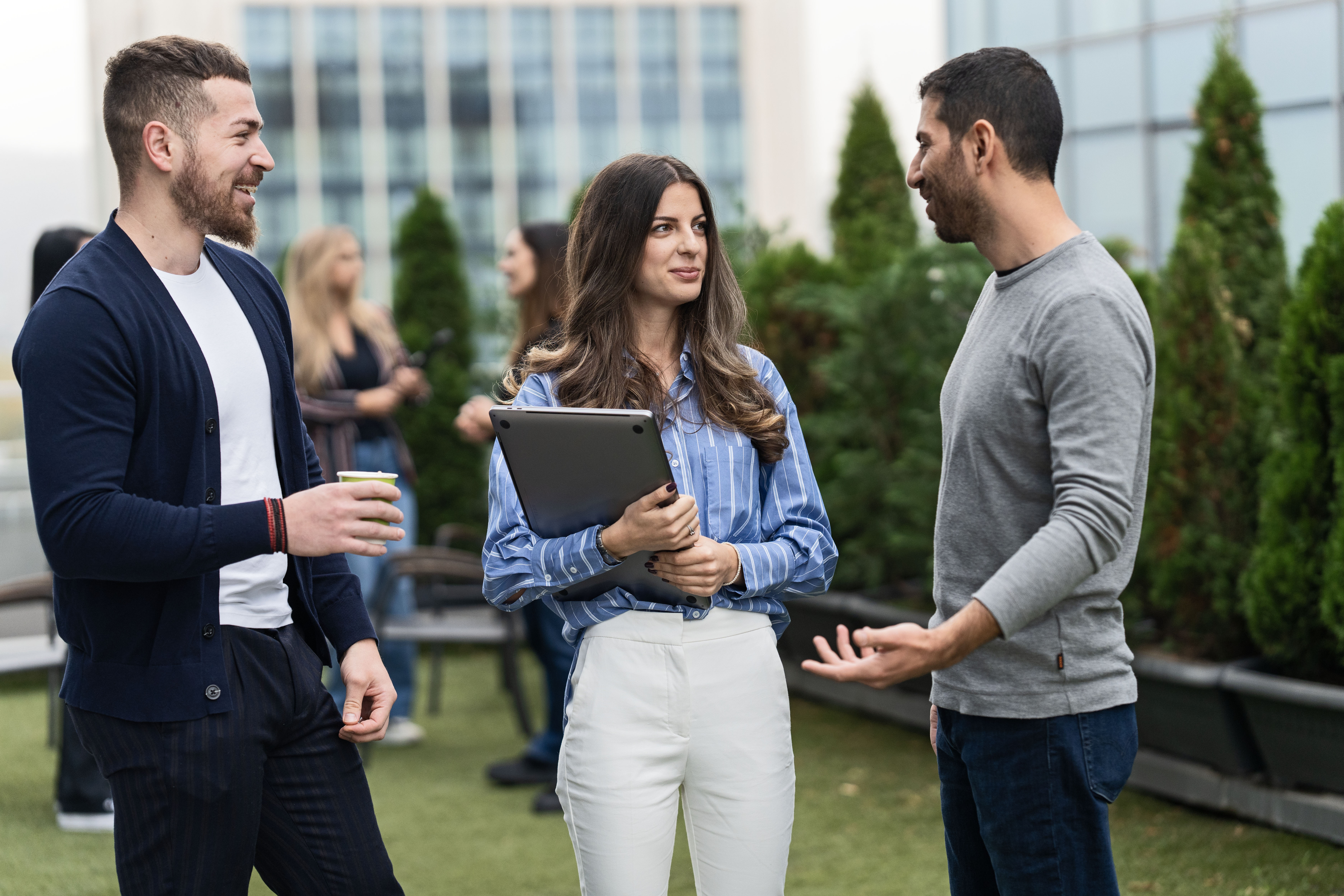 a group of people talking outside