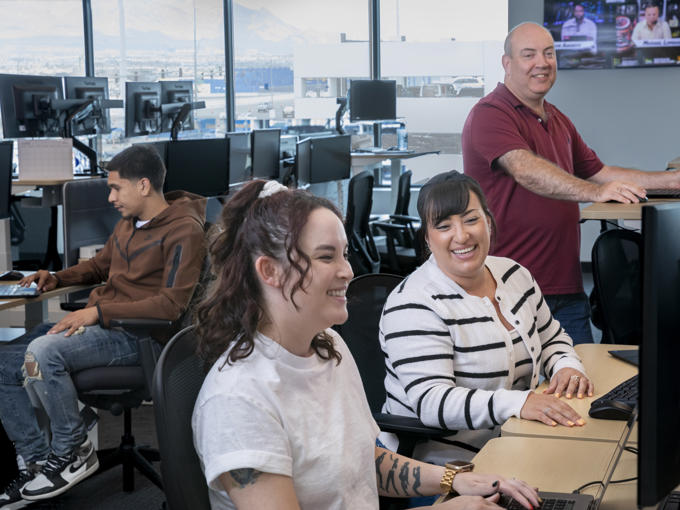 a group of people sitting at desks