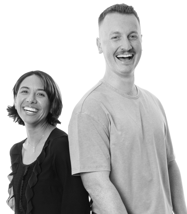 a man and woman standing back to back