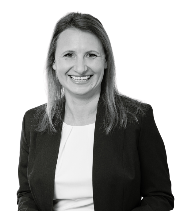 a woman smiling and standing