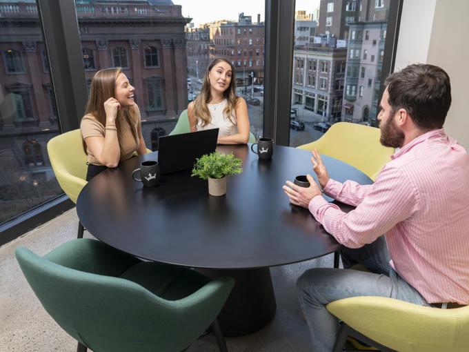 a group of people sitting at a table