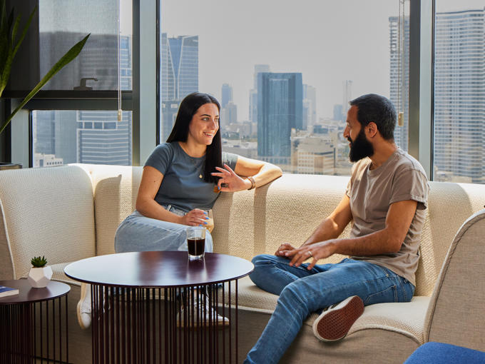 a man and woman sitting on a couch
