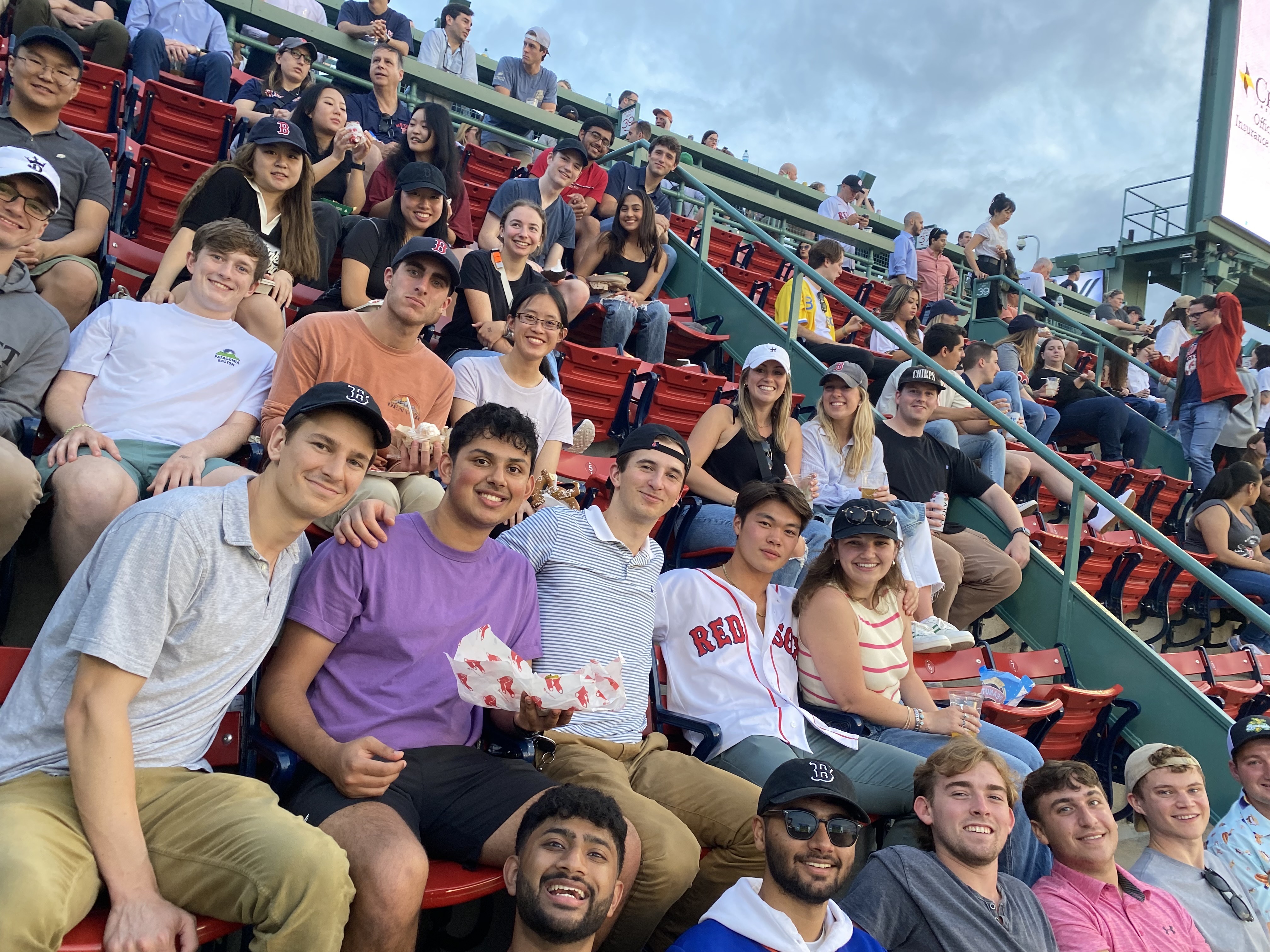 a group of people sitting in bleachers