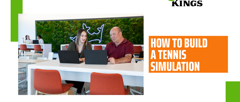 a man and woman sitting at a table with laptops